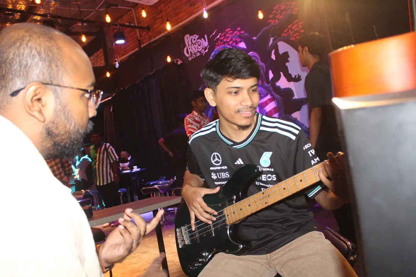 Bass player performing at an academy event